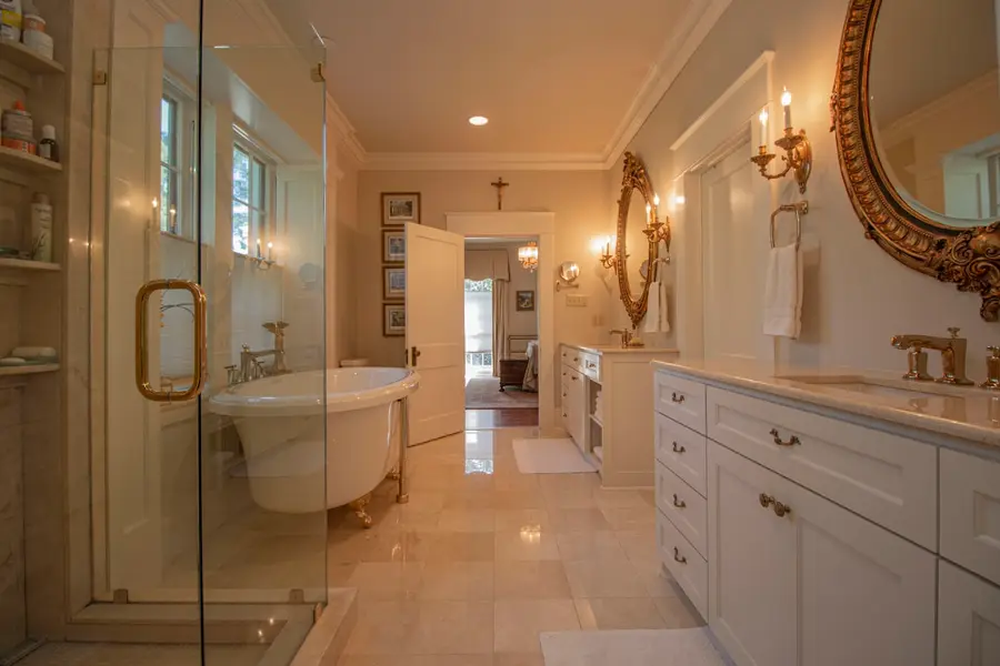 Traditional master bathroom with a freestanding tub and a glass shower
